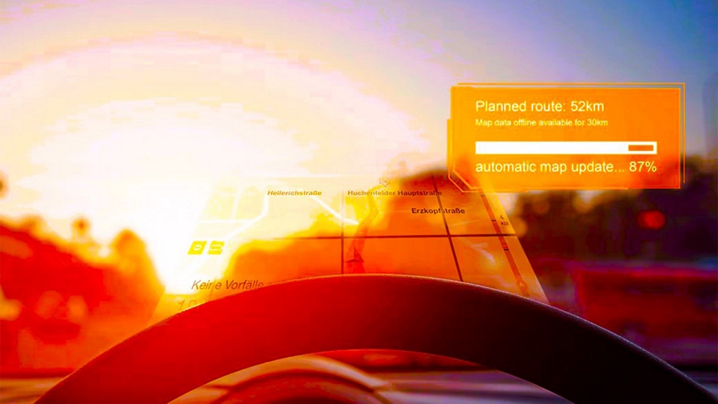Bild aus der Perspektive des Fahrers durch die Windschutzscheibe auf Karteninformationen, die von einem HUD-System auf die Windschutzscheibe projiziert werden. Xelve eHorizon Maps on Demand ist einer unserer gefragtesten Dienste auf der Xelve eHorizon-Plattform.