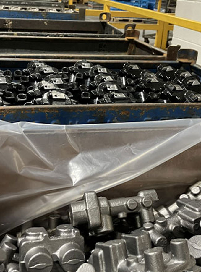 The picture shows a box full of zinc and zinc nickel coated automotive parts for the automotive industry. Zinc electroplating is one of the most cost effective ferrous metal finishings for corrosion resistance.