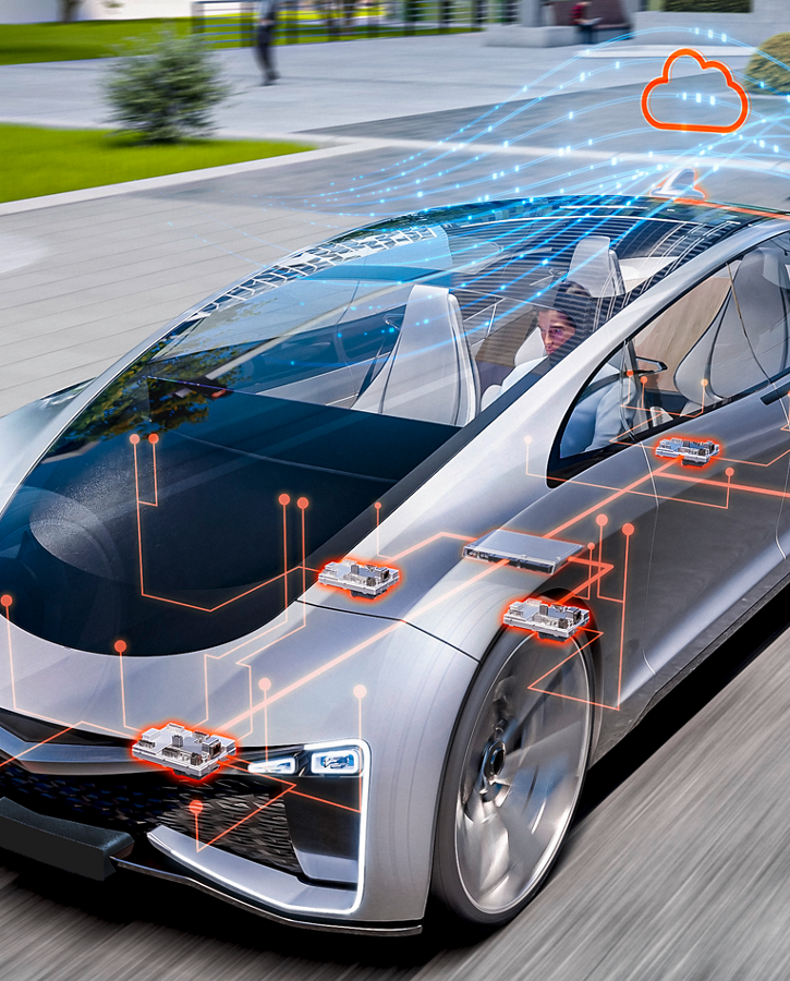 Futuristic silver car driving on a road with an overlay of digital circuit lines and highlighted zone control units. A cloud icon above the car symbolizes connectivity and cloud integration for advanced vehicle functions.